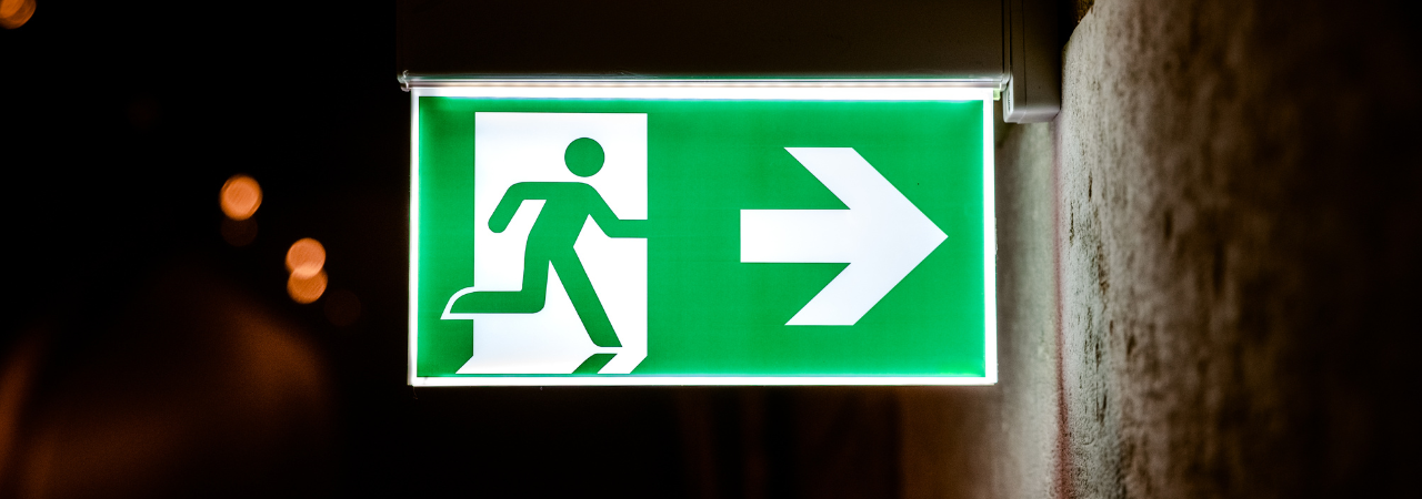 Fire Exit Light up sign against dark street