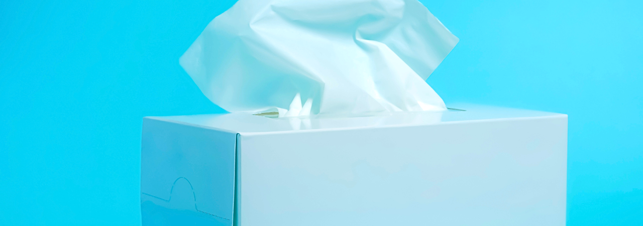 bright blue background with box of tissues as the focus